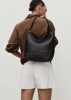 Denim shorts with frayed hem and pl